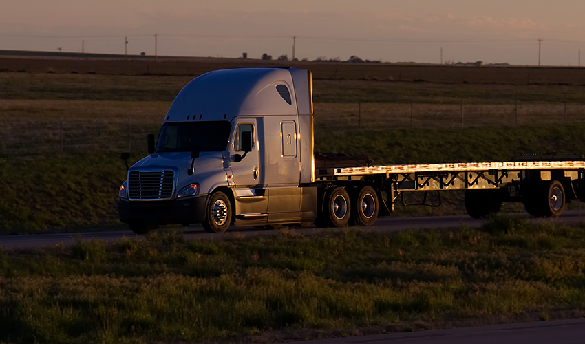Flatbed trailer loaded with heavy cargo
